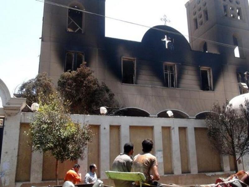 EGYPT, MINYA : A picture taken on August 14, 2013, shows the facade of the Prince Tadros Coptic church after being torched by unknown assailants in the central Egyptian city of Minya. AFP PHOTO/STR