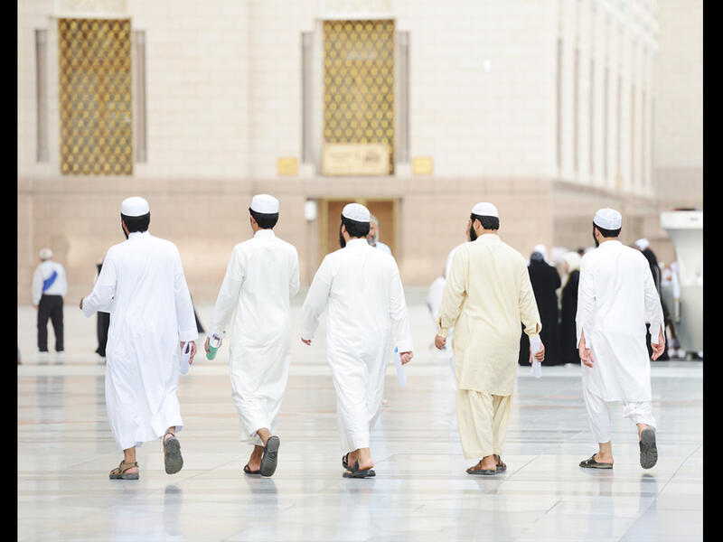 arab men going to pray 