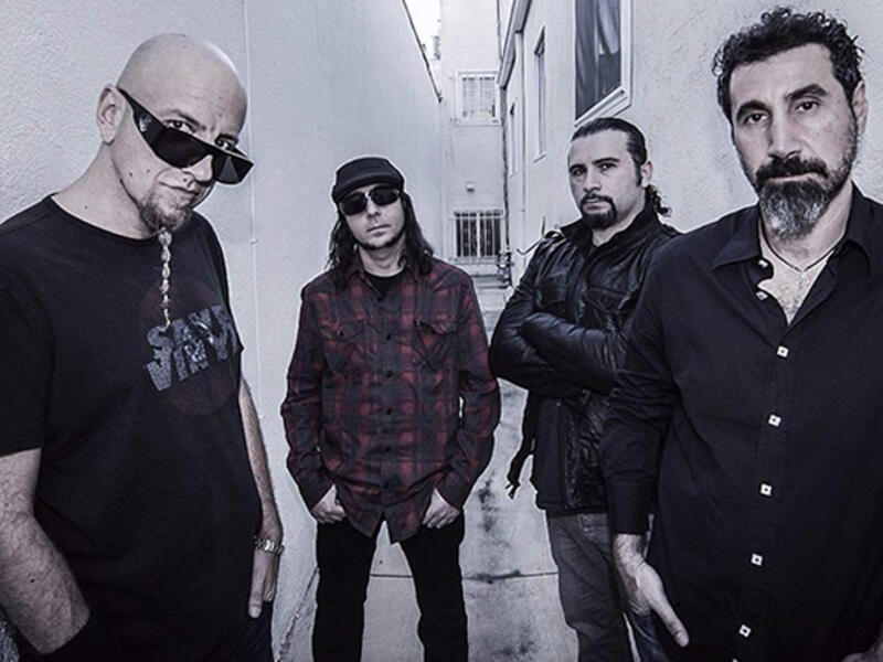 a
System of a Down also features songwriter-drummer John Dolmayan, also born in Beirut in 1973. During the Lebanese Civil War, a stray bullet hit his boyhood (and thankfully unoccupied) Beirut bed, prompting his family to emigrate and eventually landing in California, where Dolmayan would meet future bandmate Tankian.