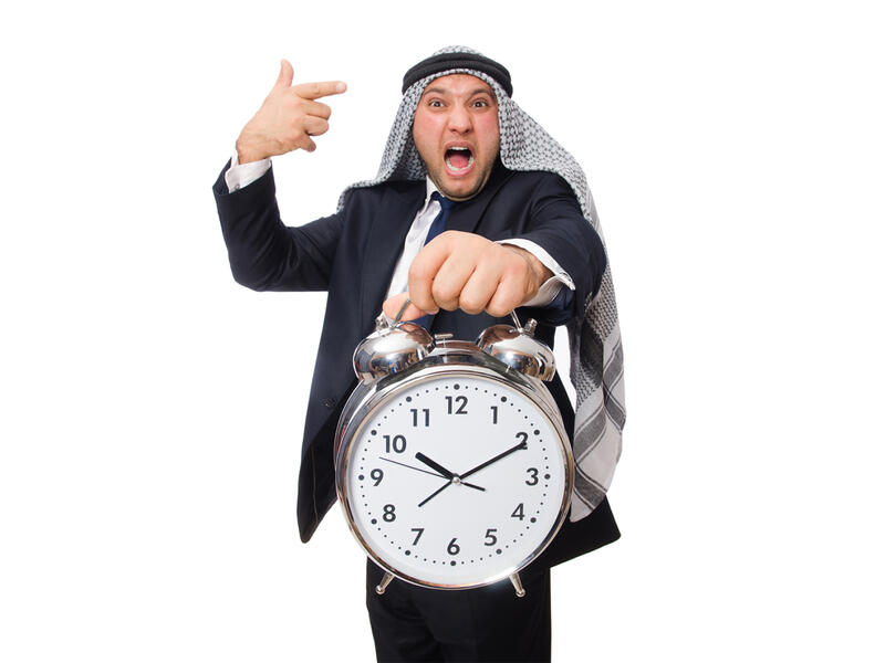 Arab man clock 