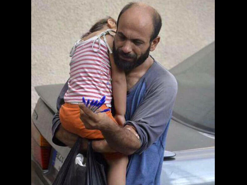 Syrian refugee selling pens