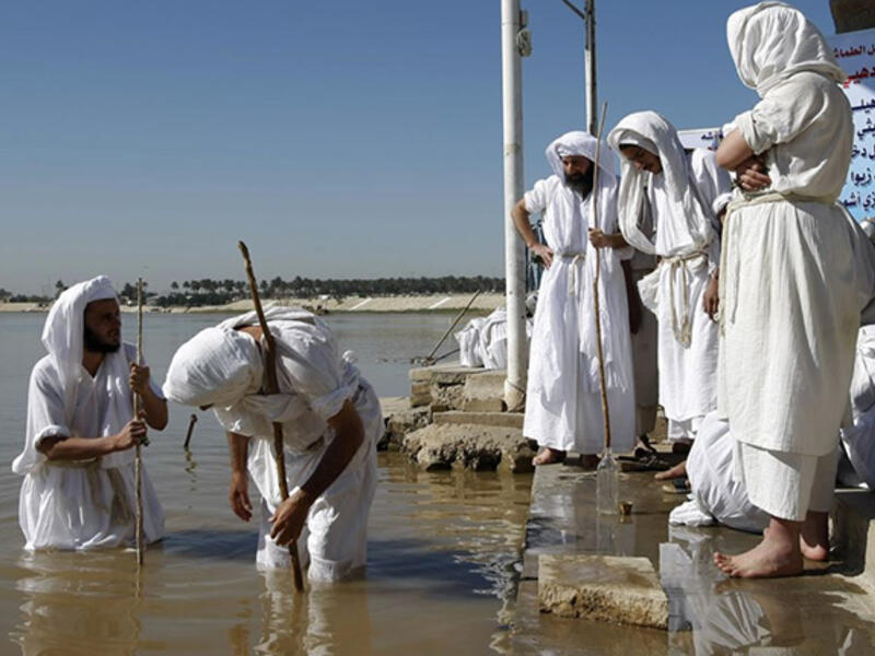 Mandaeans date back for millennia; now found in lower Iraq and southwestern Iran. They speak Arabic, Farsi, and Mandraic - their own religious language. Known for extreme pacifism, they believe only God may take a life. These monotheists face the North Star during prayer, bathe in moving water on Sundays, and view John the Baptist as their savior.
 

 