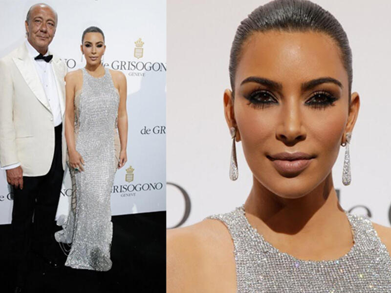 A finery pair: Kim and Fawaz were never far apart during the event. (AFP/Jean Christophe Magnenet) 