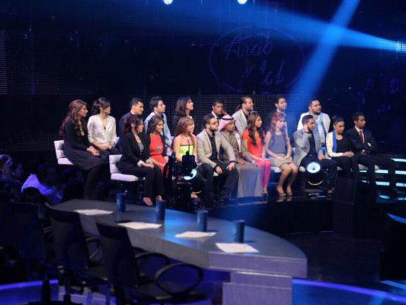 The remaining 19 Arab Idol contestants sit on pins and needles