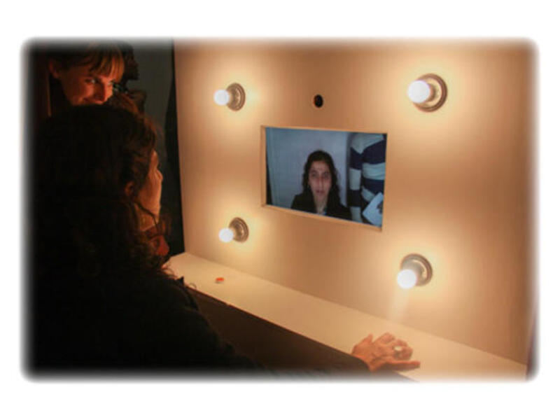 Lady tries photo-booth installation at Medrar Gallery, Friday 22 February. Photo: Mostafa Sheshtawy