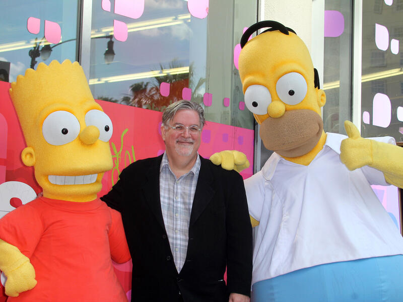 Matt Groening with Homer and Bart, notably not murdering them. (s_bukley / Shutterstock.com)