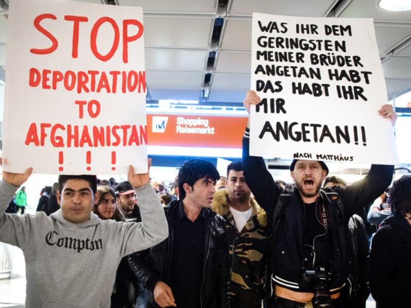 People take part in a demonstration against the deportation of some 50 Afghan refugees from Munich airport, southern Germany, on February 22, 2017. (AFP/Matthias Balk)