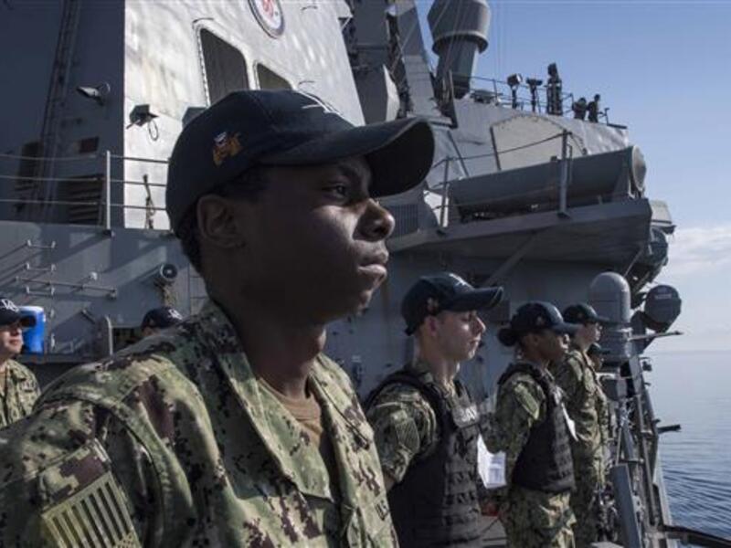 This US Navy photo obtained on Apr. 11, 2018 shows sailors as they man the rails aboard the Arleigh Burke-class guided-missile destroyer USS Donald Cook (DDG 75) as the ship departs Larnaca, Cyprus, on Apr. 9, 2018. (AFP)