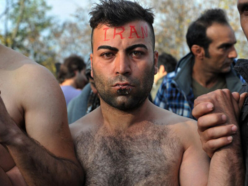 Scenes from inside the chaotic Macedonia-Greek border show Iranians and Kurds protesting their blocked entry—with needle and nylon. (AFP/File)