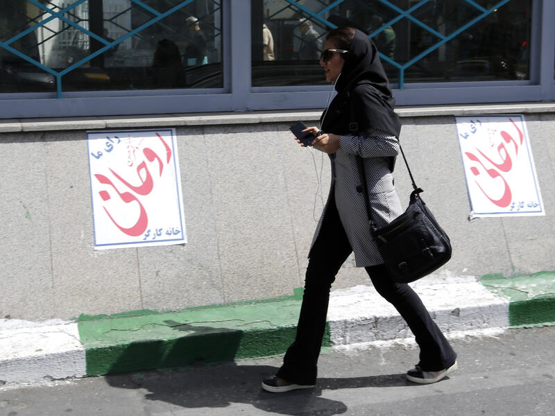 Internal alliances and predictions of tactical political moves from the candidates speak in favour of a win for Rouhani. (AFP) 
