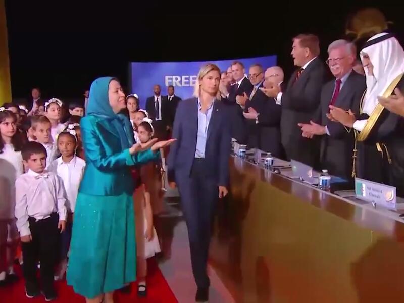 NCRI "President-elect" Maryam Rajavi greets international speakers as she arrives at the "gathering for a free Iran" on July 1.