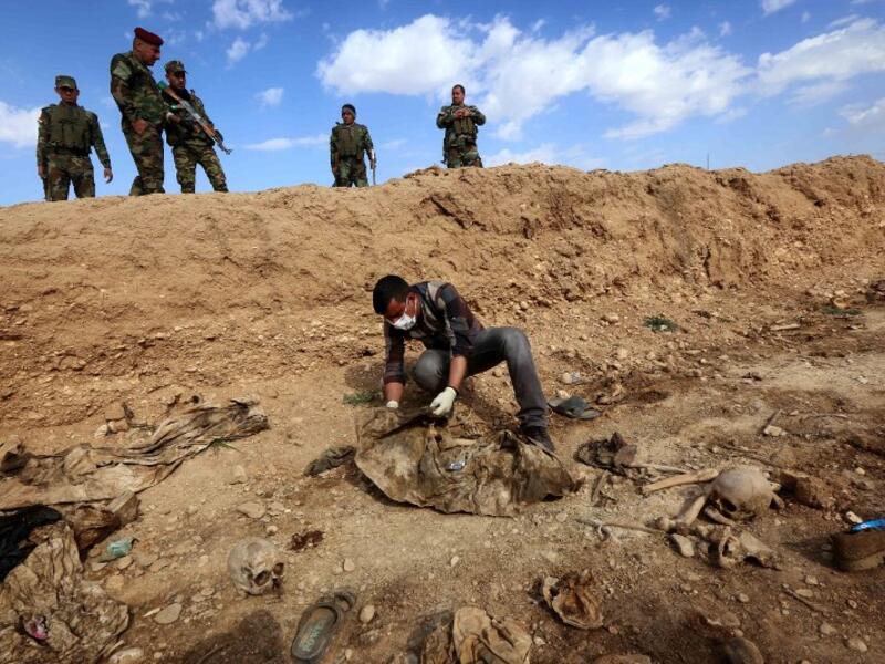 The United Nations in Iraq (UNAMI) and its human rights office said they had documented a total of 202 mass graves in parts of western and northern Iraq held by IS between 2014 and 2017.(Safin HAMED / AFP)