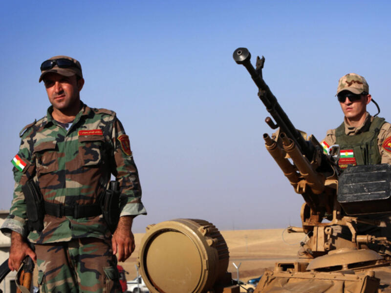 Kurdish peshmerga fighters scan the horizon at a checkpoint in northern Iraq, the group took back the north-east city of Jaloula from ISIL militants last month. (AFP/File)
