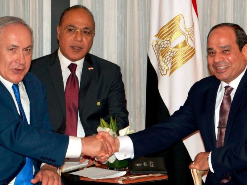A picture speaks a thousand words - and Egyptians certainly have plenty to say about viral photos of their president’s broad grin during his first public meeting with Israeli Prime Minister Benjamin Netanyahu. (Avi Ohayon/Israeli Government Press Office)
