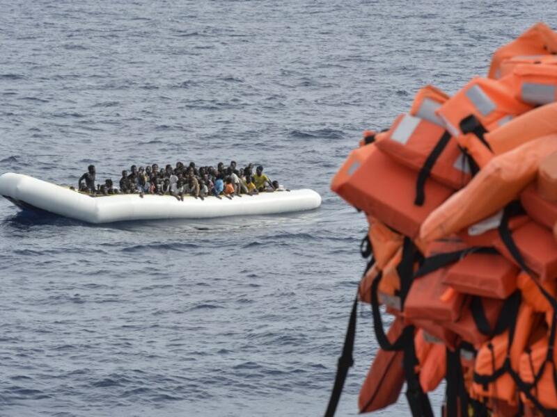 his file photo taken on November 05, 2016 shows migrants and refugees on a rubber boat waiting to be evacuated during a rescue operation by the crew of the Topaz Responder, a rescue ship run by Maltese NGO "Moas" and the Red Cross, on November 5, 2016 off the coast of Libya. (AFP/Andreas Solaro)
