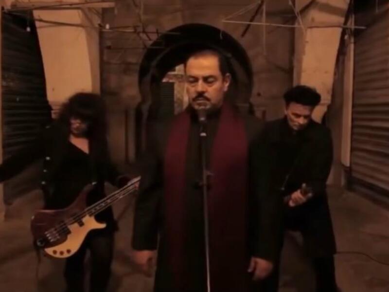 Lutfi Boshnaq (center) is the frontman for a newly formed Islamic metal band based in Tunisia. (Youtube)