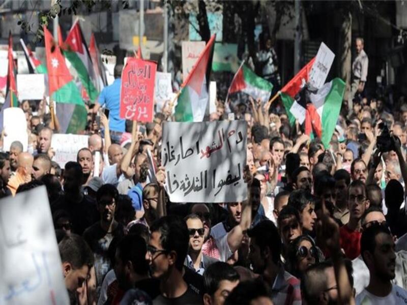 Activists have called for another hour-long blackout on Monday, and for placing the Jordanian flag on buildings.  (AFP/Ahmad Alameen)