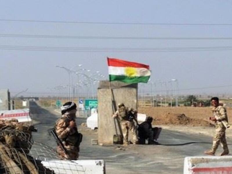 Kurdish forces guard a checkpoint between Kirkuk and Tikrit. Image used for illustrative purposes. (AFP/File)