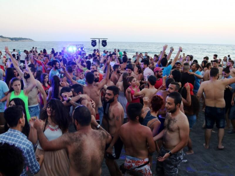 Young Syrians party at Wadi Qandeel beach in the Latakia region (AFP/File)