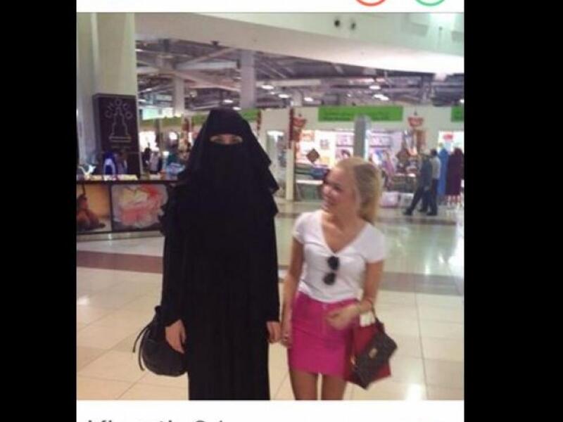 veiled woman and mini-skirted woman