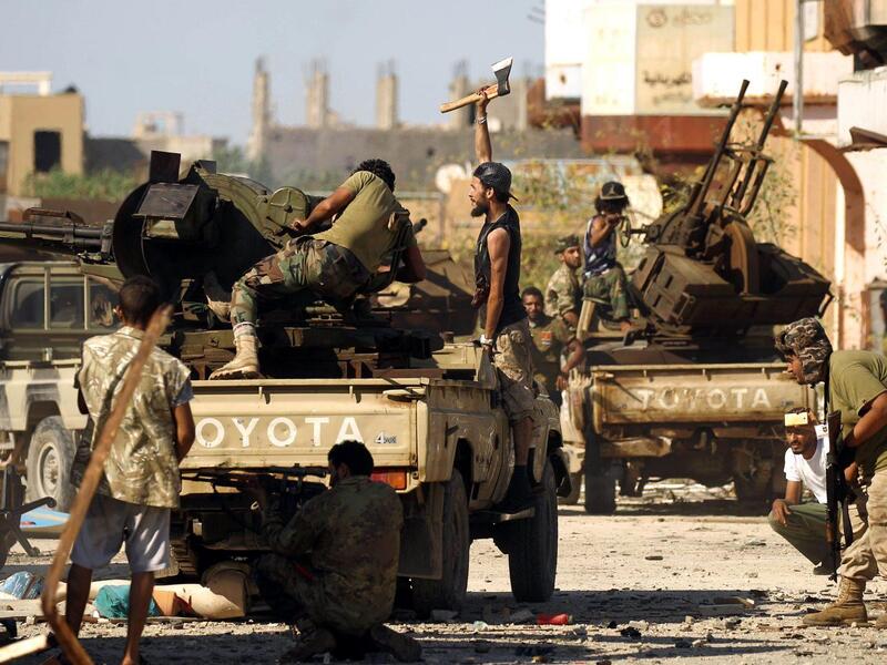 Members of the Libyan National Army (LNA), also known as the forces loyal to Marshal Khalifa Haftar, clash with jihadists in Benghazi. (AFP/File)