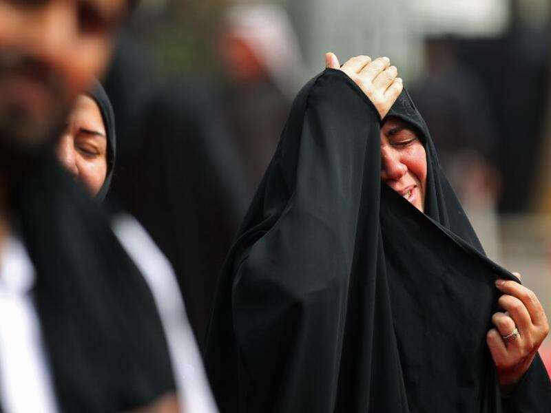 Shiite pilgrims take part in a ceremony during the ten-day mourning period leading up to Ashura, on September 19, 2018 in Iraq's holy city of Karbala. AHMAD AL-RUBAYE / AFP