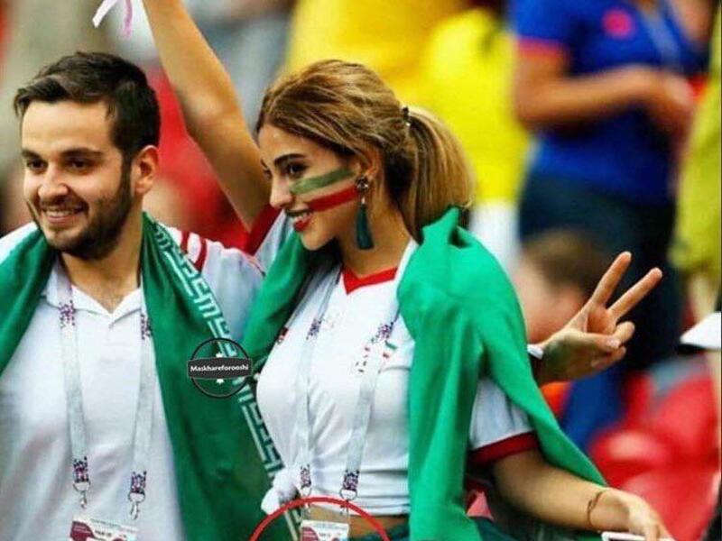 The image of an Iranian woman cheering her national football team without her hijab that appears in her ID has been going viral. (Social Media)