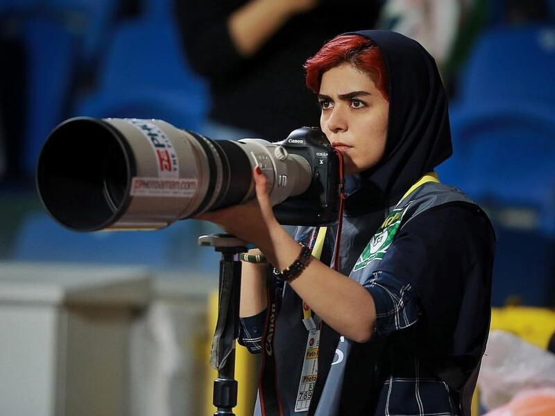 In an act of defiance, Parisa Pourtaherian covered a men football match but from a terrace of a building located near the stadium. (Parisa Pourtaherian/Instagram)