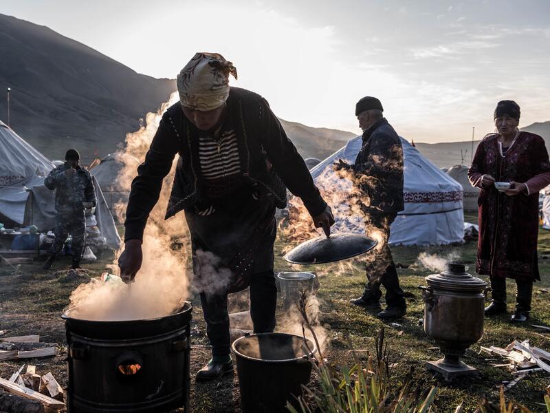 Preparing breakfast at the yurt encampment, inhabited by seasonal nomads (nytimes.com)