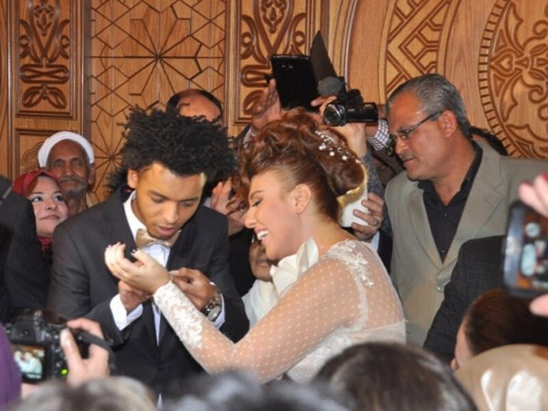 Mai Kassab and Oka celebrating holy matrimony.