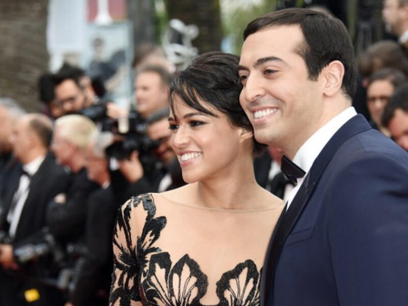 Michelle with her date Saudi Arabian film producer Mohammed al Turki. (AFP)