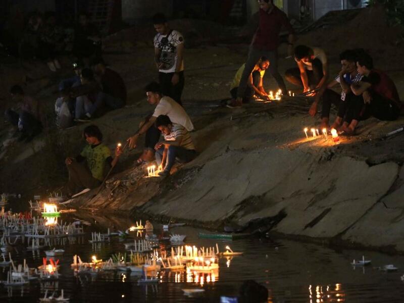 Pilgrims light candles outside of the Imam al-Mahdi shrine during the Shaabaniya ceremony commemorating the Imam's birth, the holiest figure for Shiite Muslims, in the central Iraqi city of Karbala, on May 2, 2018. the event comes two weeks before the start of the holy fasting month of Ramadan.
Mohammed SAWAF / AFP
