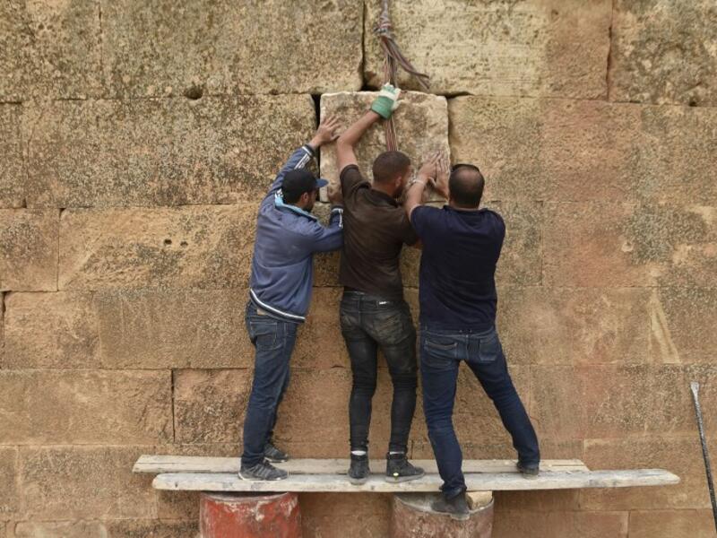 Experts and students from Algiers University’s Archaeology Institute work on one of the Jeddars pyramid tombs, near the city of Tiaret.
RYAD KRAMDI / AFP