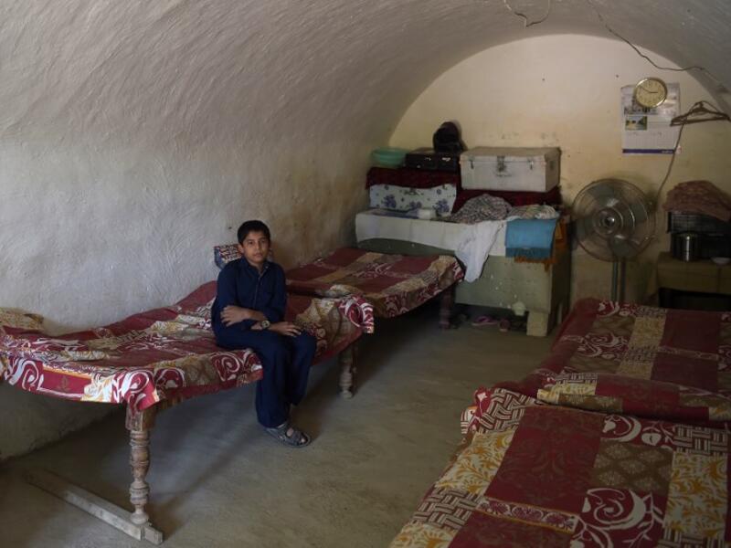 A young Pakistani villager sits in a cave room in Nikko village, about 60 kilometres from the capital Islamabad.
AAMIR QURESHI / AFP