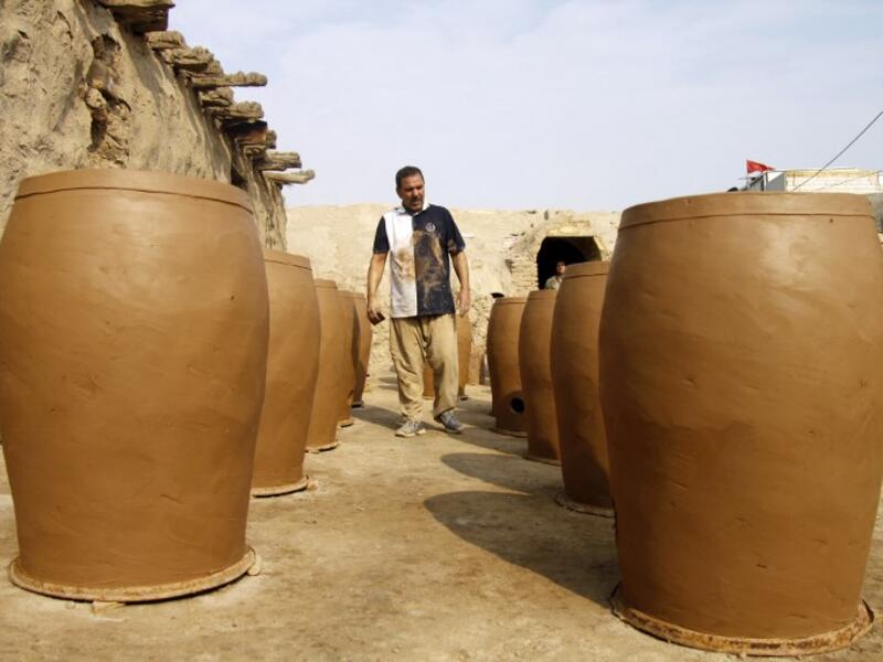 Iraqis making clay pots in Najaf on November 11, 2018. Pottery has deep roots in Iraq, where ancient civilisations turned to clay to build their homes, shape their cooking utensils, and even make their ovens.
Haidar HAMDANI / AFP