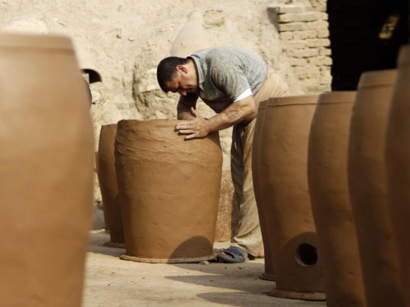 Iraqis making clay pots in Najaf on November 11, 2018. Pottery has deep roots in Iraq, where ancient civilisations turned to clay to build their homes, shape their cooking utensils, and even make their ovens.
Haidar HAMDANI / AFP