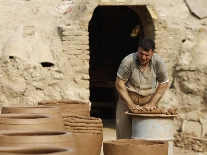 Iraqis making clay pots in Najaf on November 11, 2018. Pottery has deep roots in Iraq, where ancient civilisations turned to clay to build their homes, shape their cooking utensils, and even make their ovens.
Haidar HAMDANI / AFP