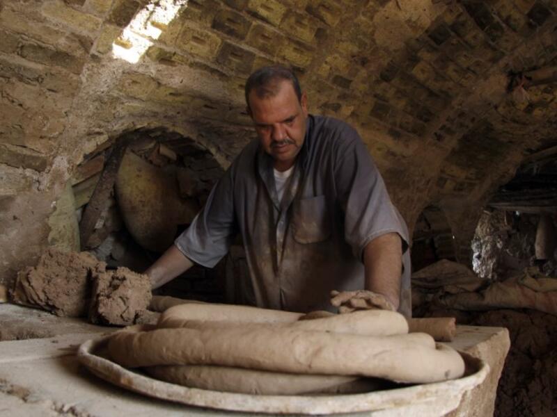 Iraqis making clay pots in Najaf on November 11, 2018. Pottery has deep roots in Iraq, where ancient civilisations turned to clay to build their homes, shape their cooking utensils, and even make their ovens.
Haidar HAMDANI / AFP