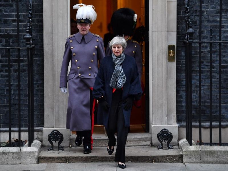 British Prime Minister Theresa May leaves Downing street to take part in a reception for Japan's Prime Minister Shinzo Abe in central London on January 10, 2019. (AFP)
