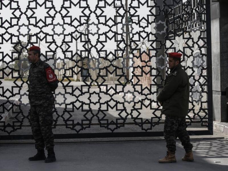 Palestinian security forces loyal to Hamas stand at the Rafah crossing point between Egypt and the southern Gaza Strip on January 24, 2019 in Rafah. 
SAID KHATIB / AFP