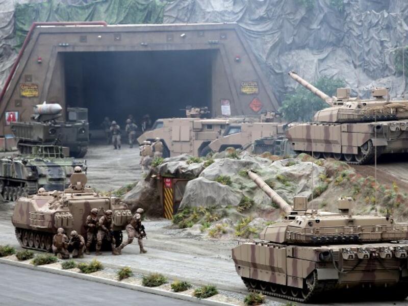 Members of the UAE Armed forces perform a military drill during the opening of the International Defence Exhibition and Conference at the Abu Dhabi National Exhibition Centre on February 17, 2019. 
AFP


