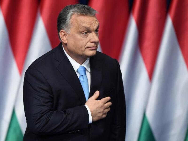 Hungarian Prime Minister and Chairman of FIDESZ party Viktor Orban reacts after delivering his state of the nation speech in front of his party members and sympathizers at Varkert Bazar cultural center in Budapest. (AFP)