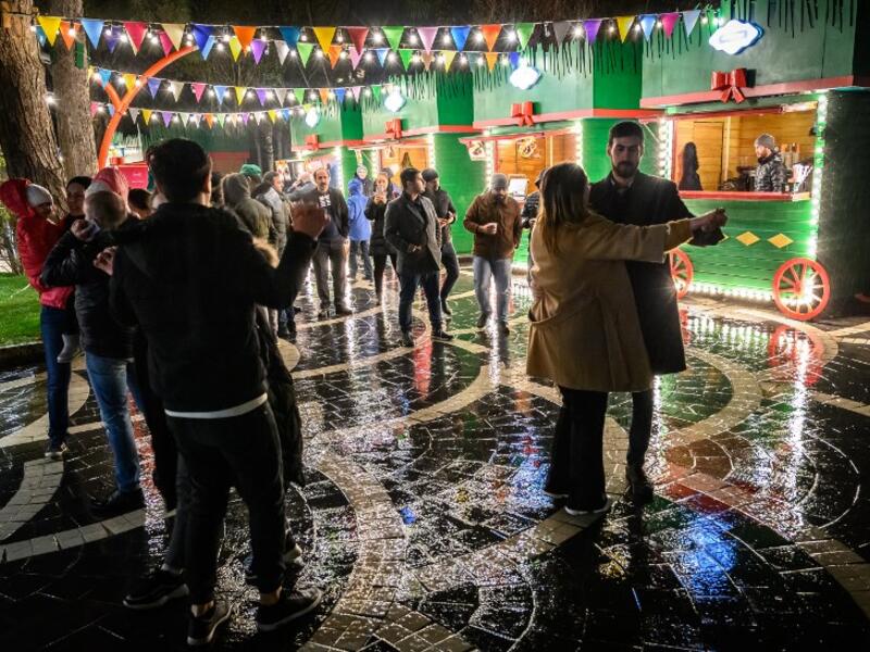 People dance at a Nowruz holiday market in Baku on March 20, 2019. Nowruz marks the first day of spring and the beginning of the year in the Persian calendar.
Mladen ANTONOV / AFP