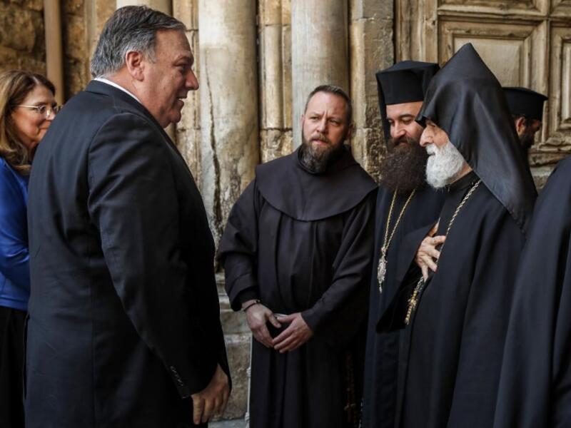 US Secretary of State Mike Pompeo (2nd-L) is greeted by Christian clergymen from various denominations as he visits the Church of the Holy Sepulchre in Jerusalem's Old City on March 21, 2019. 
JIM YOUNG / POOL / AFP
