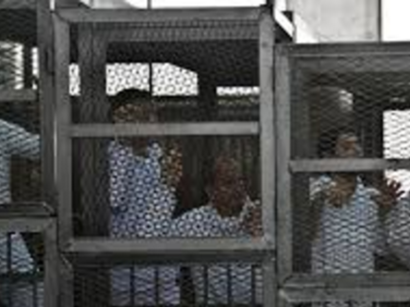 Muslim Brotherhood members await trial. (AFP/Khaled Desouki)