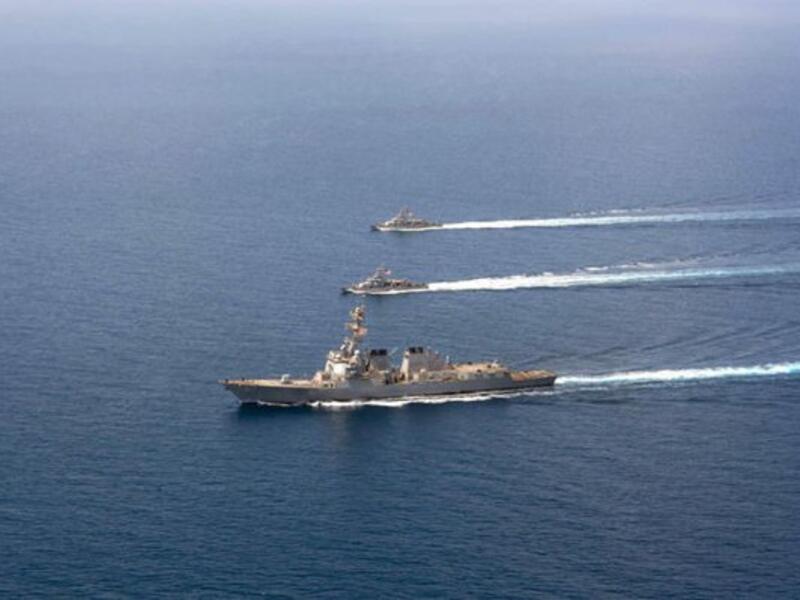 A file image released by the US Navy shows a guided-missile destroyer USS Mason (DDG 87) conducting formation exercises with the Cyclone-class patrol crafts USS Tempest (PC 2) and USS Squall (PC 7) on September 10, 2016. (AFP/Navy Visual News Service)