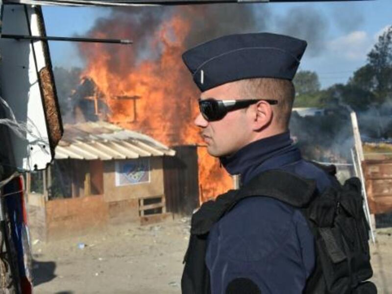 Officials expect the operation to become more difficult over the course of the week, after those who volunteered to leave are transported to accommodation centres and only those reluctant to give up on reaching Britain remain the camp. (AFP/File)