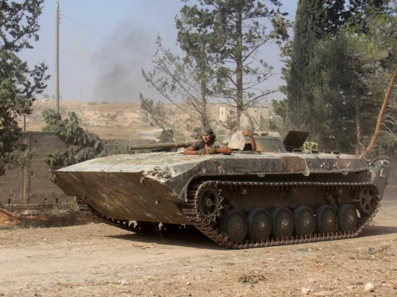 Nusra Front fighters south of Aleppo. They now go by the name Jabhat Fatah al-Sham (AFP/Omar Haj Kadour)