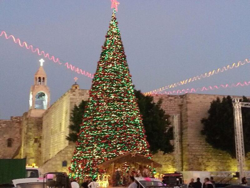 Bethlehem typically puts on a show at Christmas time, with a huge tree in Manger Square, and a Christmas Eve procession. None of this erases the struggles of occupation facing the West Bank town, symbolized by the Her Homa Israeli settlement which looms from the opposite hill, and the partition wall which chokes Aida Camp.