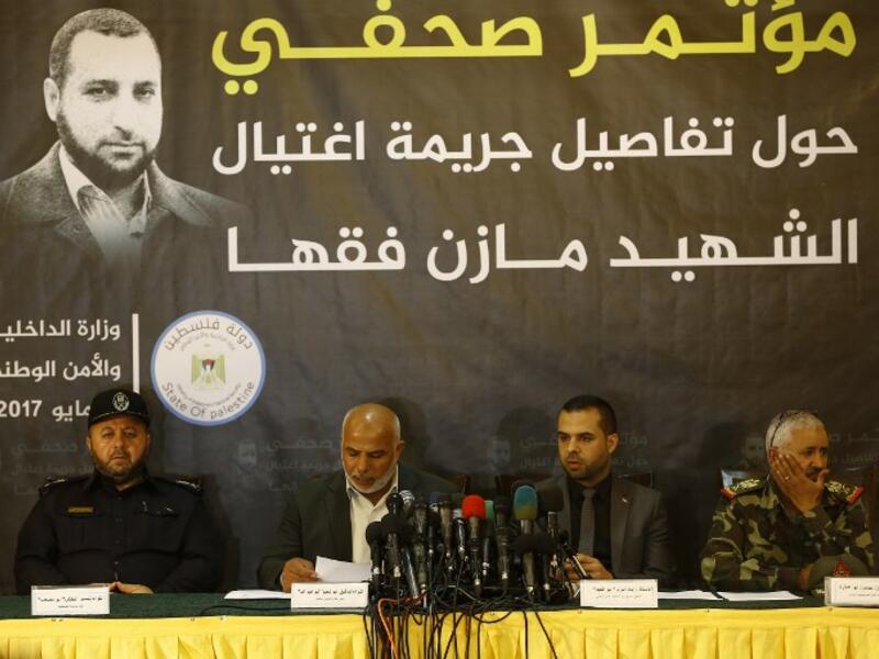 Tawfiq Abu Naim (2nd L), head of Hamas-run security forces in Gaza, speaks during a press conference on the killing of senior Hamas official Mazen Faqha, in Gaza City, on May 16, 2017. (Mohammed Abed/AFP)